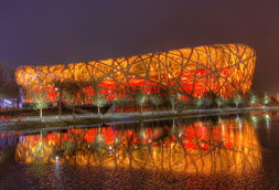 Beijing bird's nest building at night with reflection